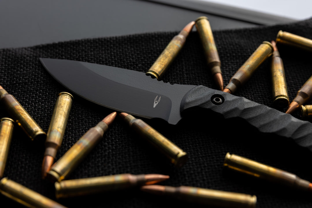 Blacked out Warlord fixed blade close up shot showing  detailed Dagr and Nott Logo